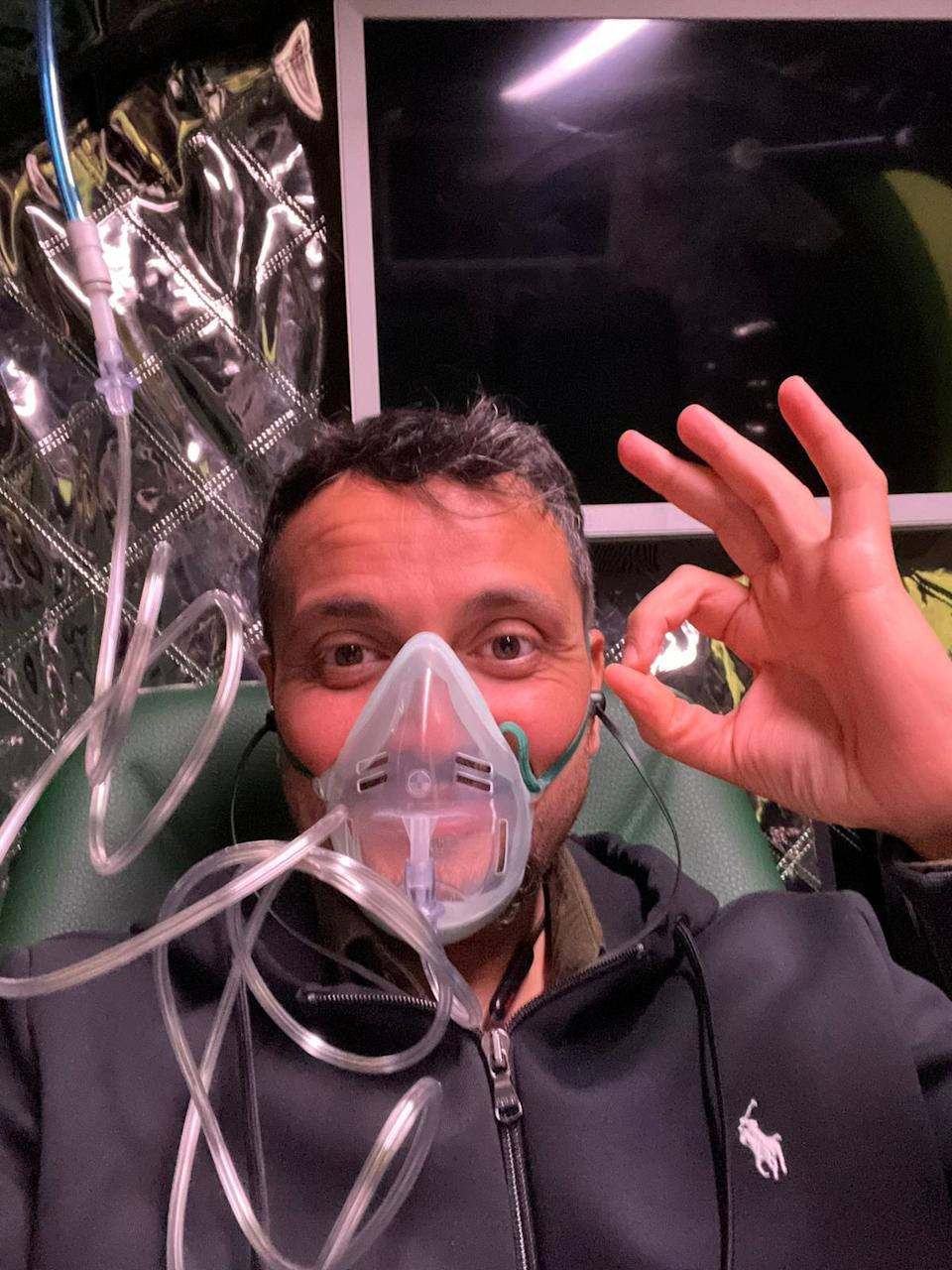 A man wearing an oxygen mask.