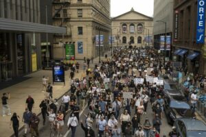 Car plows through Chicago protest as...